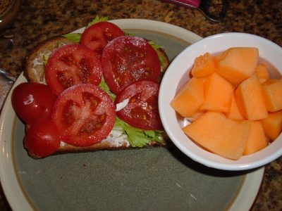 cream cheese sandwich with cantaloupe