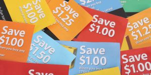 Cutting coupons in different colors, and price ranges from free to a few dollars