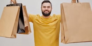 man holding shopping bags