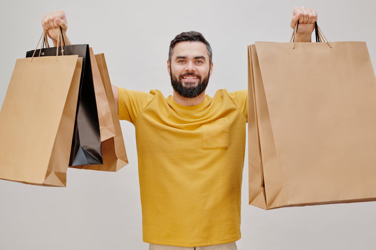 man holding shopping bags