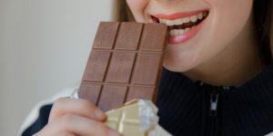 woman holding food wrapper