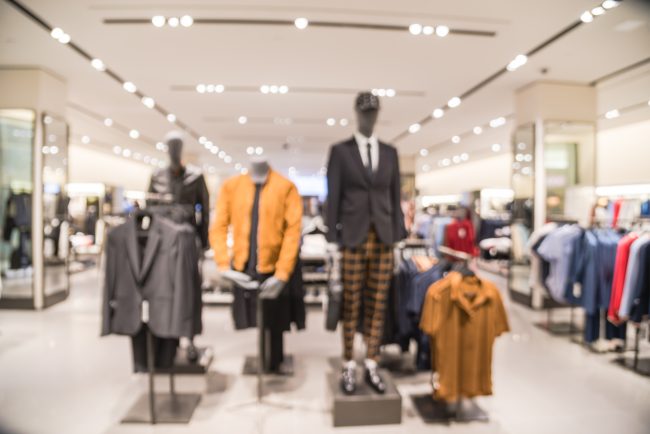 Blurry background trending fall collection at men clothes shop in Texas, America retailers with strict return policies
