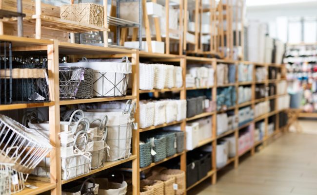 Decorative storage boxes on shelving in household goods store high-risk items