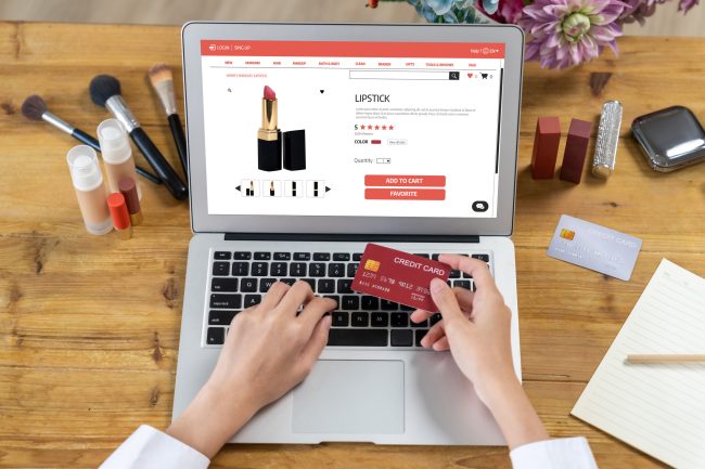 Woman shopping online on internet marketplace browsing for uttermost sale items digital coupons