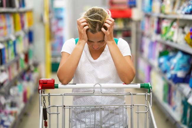 Supermarket girl with shopping trolley shop when you’re tired