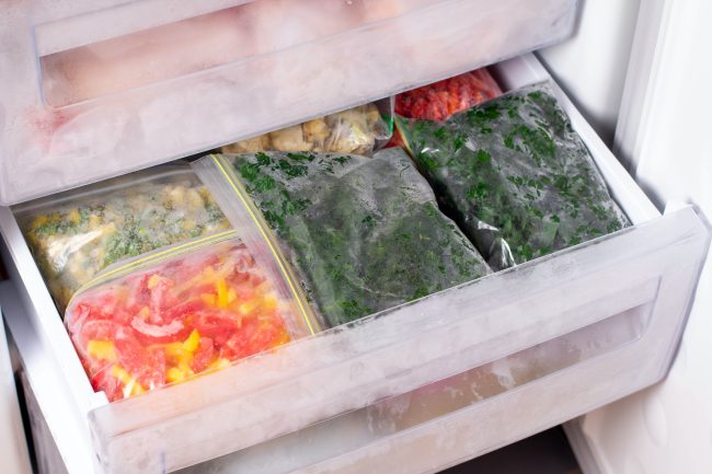 Frozen parsley in a plastic bag in the freezer frozen foods