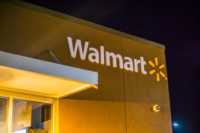 Walmart building sign and logo at night deceptive pricing