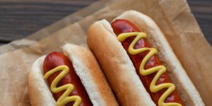 Hot dogs are a summer staple—from backyard cookouts to ballpark snacks—but not all franks are created equal. Plenty of brands sneak in fillers, preservatives, or cheap cuts that dilute quality and flavor. If you care about real ingredients and better taste, opting for hot dog brands made entirely with real meat makes a difference. These options offer transparency, nutritional value, and flavor that actually delivers. Here are eight hot dog brands that cut the junk and keep it all meat. 1. Applegate Naturals Applegate Naturals Beef Hot Dogs are among the cleanest franks out there. They’re made with 100% grass-fed beef, with few ingredients besides water, vinegar, dried vegetables, and spices. The company prioritizes regenerative sourcing practices, meaning the beef comes from farms that focus on environmental health. While the price is higher—around $8—they deliver premium, natural flavor. If you're looking for an ethical, healthy choice, Applegate Naturals is a strong pick. 2. Niman Ranch Niman Ranch hot dogs stay true to real meat—no antibiotics, fillers, or by-products allowed. These franks are nitrate-free and smoked for flavor, not preservation. The brand’s mission emphasizes humane animal treatment and sustainable farming. While the ingredient list includes minor additives like dextrose and sodium phosphate, purists still respect the near-clean profile. Great taste, better farming—Niman delivers both. 3. Hebrew National A classic favorite, Hebrew National has long built a reputation on quality. Their All-Natural Beef Franks are made with 100% kosher beef—no fillers, artificial flavors, or by-products. The brand sticks to higher standards, even long before meat quality became trendy. Known for a satisfying snap and deep flavor, they balance tradition with ingredient integrity. If you trust just one brand to deliver honest franks, Hebrew National is that one. 4. Nathan’s Famous (All-Natural Uncured) Nathan’s might be famous for Coney Island, but its All-Natural Uncured line brings serious ingredient ethics to the table. These franks are made from 100% beef, with no fillers, by-products, corn syrup, nitrates, or artificial ingredients. Free from preservatives, they offer a clean, classic hot dog taste that even food guides applaud. Nathan’s fans get nostalgia and quality in one. 5. Organic Valley / Organic Prairie These brands cater to organic-minded eaters, and they deliver. Their hot dogs are made with 100% grass-fed, pasture-raised beef or turkey, free from antibiotics, hormones, nitrates, fillers, or artificial preservatives. The result is a natural, wholesome flavor that stands out in quality. The organic label isn’t just for show—it reflects what really goes into the meat. Perfect for health-conscious families or eco-aware consumers. 6. Snake River Farms American Wagyu Looking for indulgence? This is it. Snake River Farms squeezes premium American Wagyu into hot dogs—no fillers, by-products, or artificial preservatives. Though pricey (about $12 per pack), it’s worth it for a high-end flavor experience with unmatched beef richness. For special occasions or treating yourself, these franks elevate the standard dog. 7. Boar’s Head Uncured Beef Frankfurters A go-to deli staple, Boar’s Head offers top-tier quality in frankfurter form. Made with 100% USDA Choice beef, these uncured franks lack fillers and stick to simple, traditional ingredients. Beefy, slightly smoky, and with a natural snap, they’re indulgent yet honest. This brand delivers depth of flavor without the garbage. 8. Kirkland Signature (Costco) Costco’s in-house Kirkland hot dogs aren't just cheap—they’re surprisingly clean. These dogs use 100% beef, maintaining a juicy, flavorful experience that matches their food court legacy. With USDA Choice cuts and tight quality control via Costco’s own plants, they punch above their price. If you love Costco’s hot dog combo, you’ll love knowing your franks are all meat. Why These Hot Dog Brands Stand Out From frugal to gourmet, each of these hot dog brands prioritizes real meat, transparent ingredients, and flavor that earns its keep. Whether you're raising the bar on quality, reducing artificial nasties from your plate, or simply craving better taste—these brands deliver. From grass-fed to Wagyu, kosher to organic—there’s a clean dog out there for every preference and budget. Which of these hot dog brands are you most excited to try—or already love? Drop your favorites in the comments and let's get a debate going! You May Also Like... Elevate Your BBQ: 12 Cookout Dishes That Aren’t Burgers or Hot Dogs 5 Mistakes You’re Making When Grilling Hot Dogs What Makes A Really Great Burger? Americans Weigh In 7 Popular Hot Dog Brands You Shouldn’t Put On Your Grill This Season The Costco $1.50 Hotdog and Drink Meal—Why The Price Will Never Change
