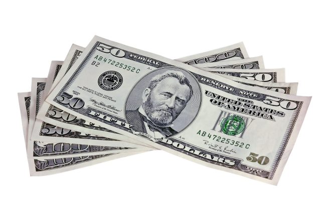 Fifties and Hundred Dollar bills. 10 Grocery Hacks That Actually Save You $50 A Month