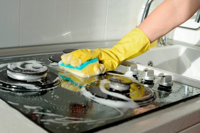 A,Hand,In,A,Yellow,Rubber,Glove,Washes,A,Gas cleaning