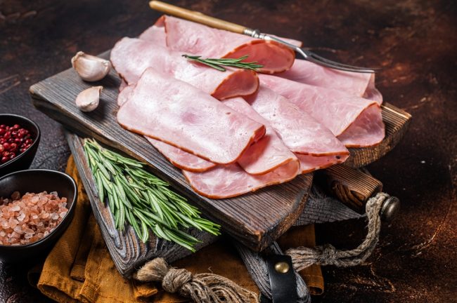 Flat,Slices,Of,Square,Sandwich,Ham,With,Herbs.,Dark,Background. deli