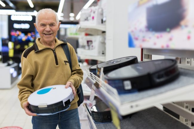 Elderly,Man,Looks,At,The,Robot,Vacuum gadgets