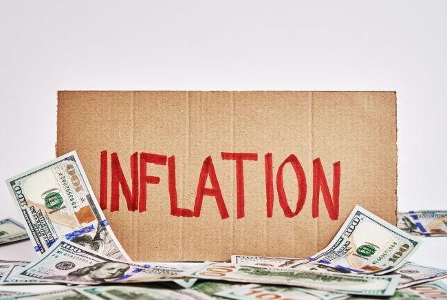 World,Economic,Crisis,And,Inflation,Concept,,Cardboard,Sheet,With,Word inflation