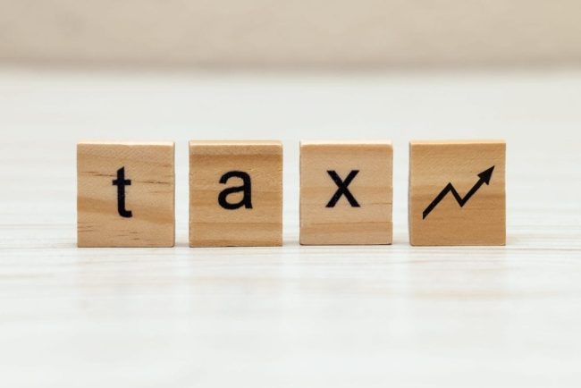 Wooden,Blocks,Arranged,On,A,Smooth,Surface,Show,The,Word How Grocery Rewards Programs Became the New Tax on the Poor