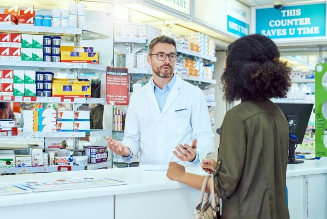 Man,,Pharmacist,And,Talking,With,Customer,For,Healthcare,Advice,,Medication insurance issues