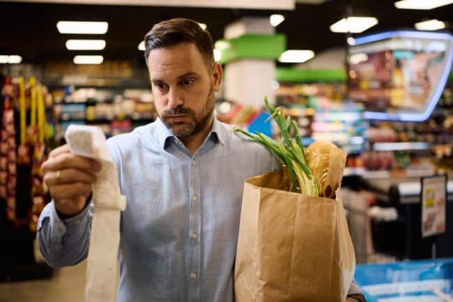 shutterstock_2703096057 8 Hidden Fees Hiding on Your Grocery Receipt