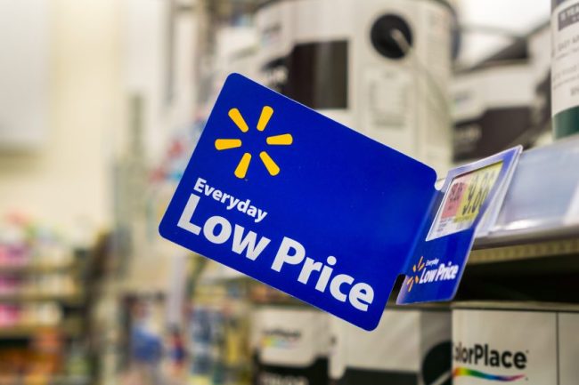 A blue Walmart Everyday Low Price sign hanging on a store shelf. Walmart vs Aldi vs Kroger: Which Grocery Store Actually Has the Lowest Prices in July 2026?