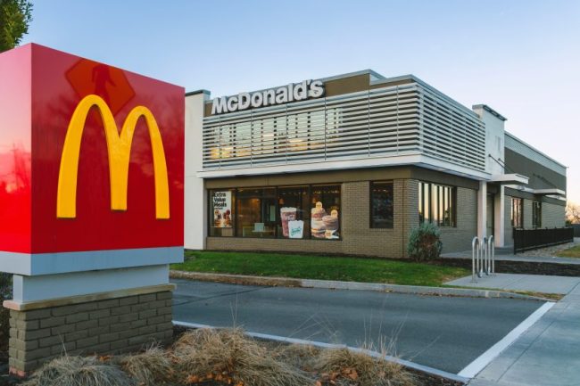 A McDonald’s restaurant exterior featuring a tall red sign with the golden arches logo. Ordering the “Meal” Feels Like the Better Deal — But These Fast-Food Combos Say Otherwise